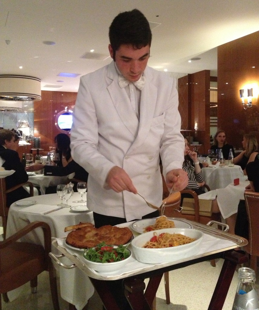 Waiter serving pasta at Cipriani