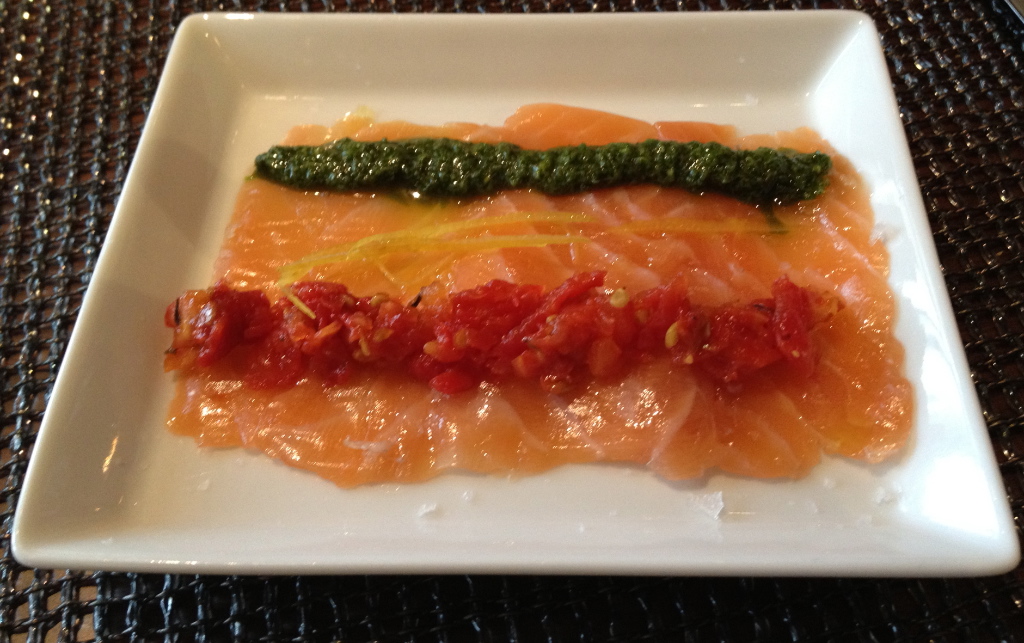 Salmon carpaccio with pesto and tomato puree
