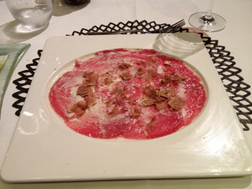 Beef carpaccio with parmesan cheese and truffles