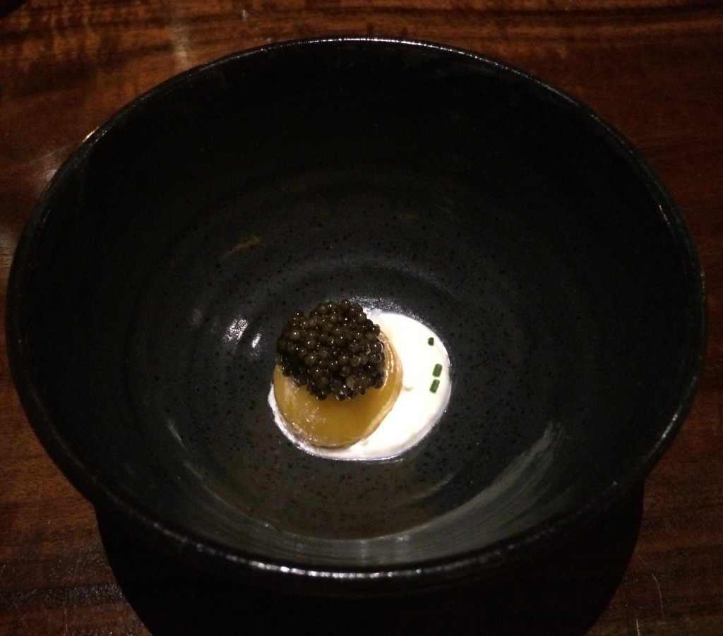 California Sturgeon Caviar on egg yolk poached in smoked oil, creme fraiche, chive