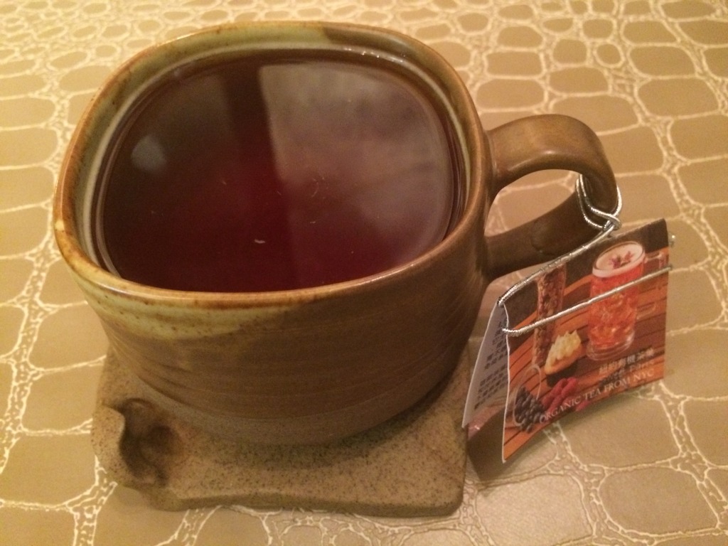 Cup of fruit & herbal ayurvedic infusion at DK Cuppa Tea